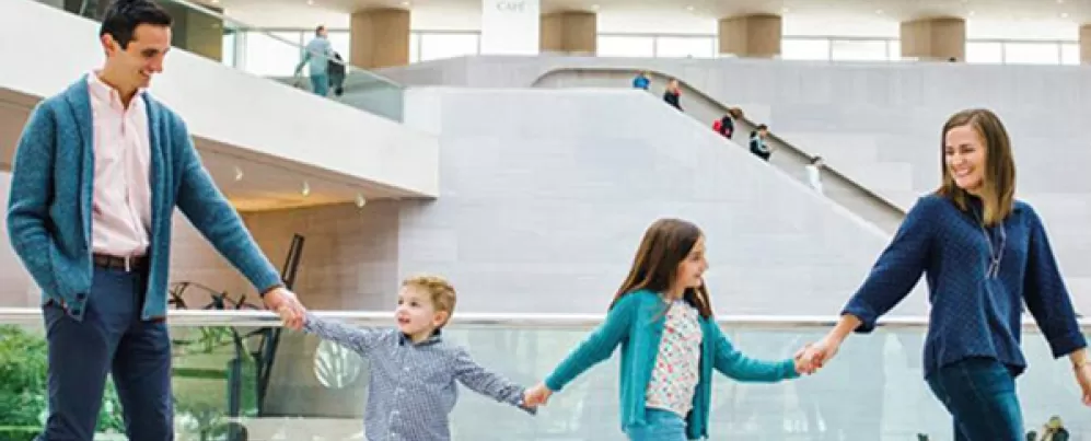 Free museum experiences in Washington, DC - Family at the National Gallery of Art East Building on the National Mall
