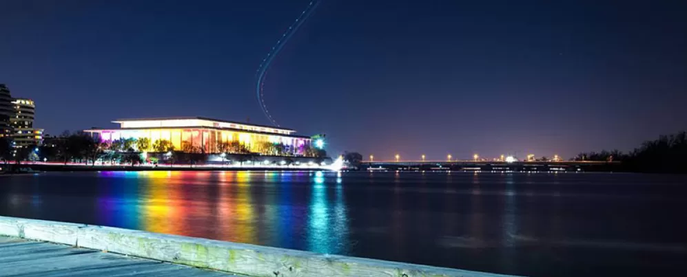 The John F Kennedy Center lit up with rainbow lights